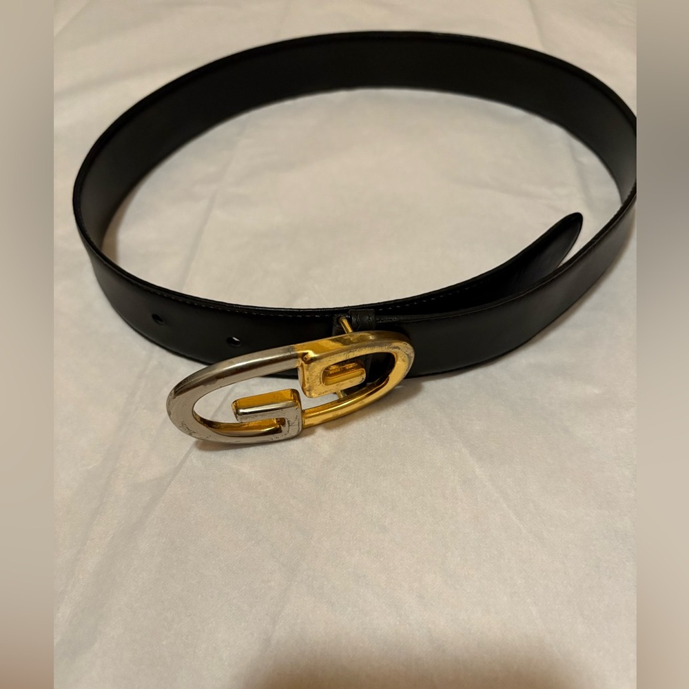 GUCCI, Black Leather Belt with Gold and Silver Buckle. PRE- OWNED